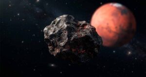 Кусок марсианского метеорита на фоне красной планеты в космосе